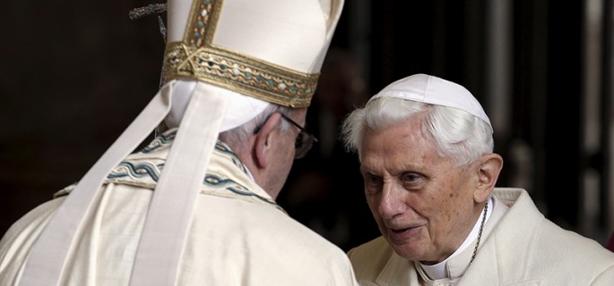 Pope Francis, left, meets Emeritus Pope Benedict XVI before open the Holy Door to mark opening of the Catholic Holy Year, or Jubilee, in St. Peter's Basilica, at the Vatican, on December 8, 2015. Photo courtesy of REUTERS/Max Rossi